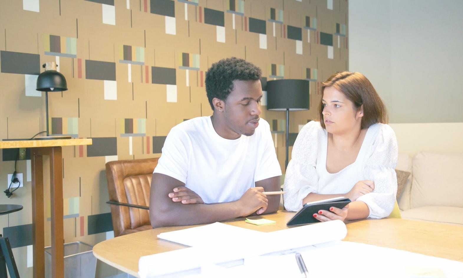 Students reviewing market data during workshop